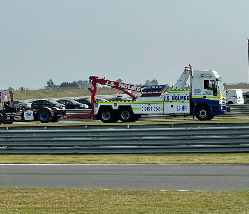  J.S. Holmes recovery truck driving on a race track