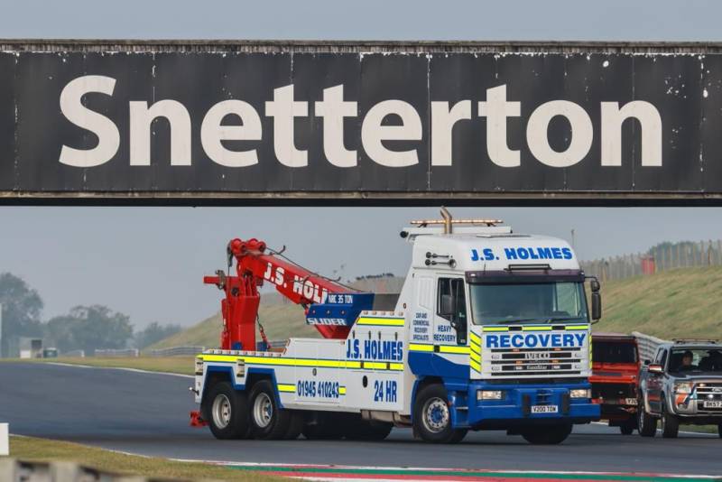 J.S. Holmes recovery truck driving on Snetterton race track. 